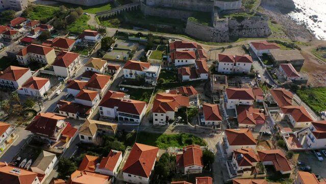 Aerial view of red rooftops and Methoni Castle