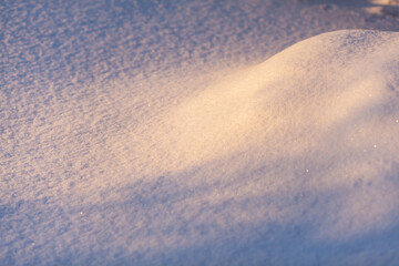 Clean, white snow close-up. Winter background. Snow surface. Fresh fluffy white snow texture.White snowflakes. 