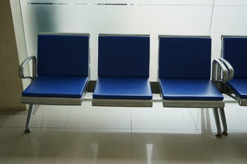 Blue chairs lined up in the public service room in government.