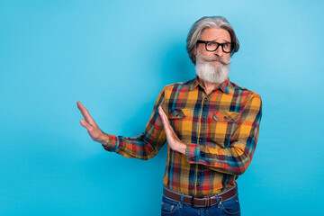 Photo of upset man pensioner dressed checkered shirt glasses asking stop arms empty space isolated...