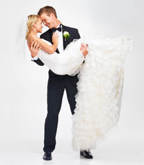 Ill always be here to support her. Attractive young groom holding his bride as they get ready to...
