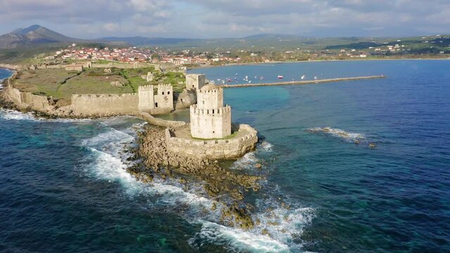 Aerial view of a fortified islet and Methoni Castle