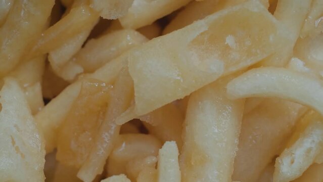 Chak Chak - fried crunchy honey cake on rotating surface - close up, top view, macro. Traditional Tatar and Bashkir cuisine, oriental dessert, food, pastry and Tatarstan national sweet concept