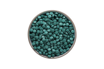 spirulina tablets in a plate on a white background, isolated on a white background. Healthy food supplement. Super food ingredient. top view