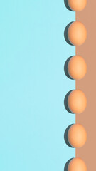 Easter egg and spring celebration concept. Flat lay optimistic composition, minimal pastel and brown background. Vertical visual arrangement.