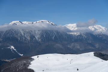 Fototapeta na wymiar snow covered mountains, Bucegi Mountains, viewpoint from Baiului Mountains, Romania 