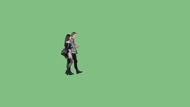 A young guy in a plaid shirt and a girl in a short skirt are walking together. Alpha channel included