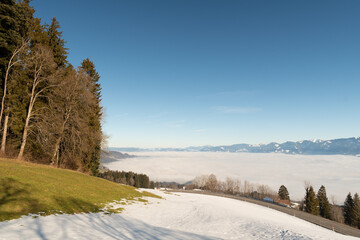 Mist of fog over the swiss and austrian mountains