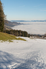 Naklejka premium Mist of fog over the swiss and austrian mountains