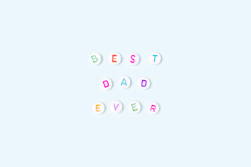 Best dad ever. Quote made of white round beads with colorful letters on a blue background. Fathers...