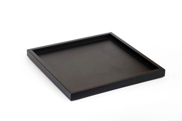 Black square tray for tea and coffee isolated on a white background