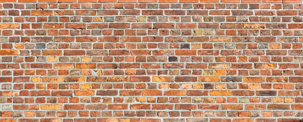 Beautiful old brick wall on a farm, in panoramic format.