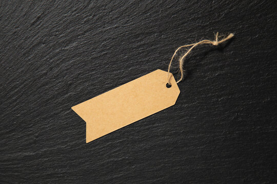 retro cardboard hang tag on a slate tile