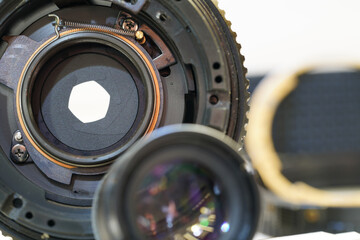 Clean and disassemble the lens for photography into its component parts