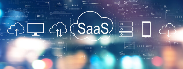 SaaS - software as a service concept with blurred city lights at night