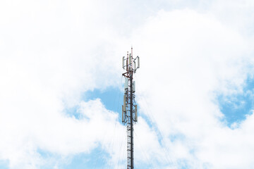 Obraz premium Telecommunication mast TV antennas in the afternoon ,on the hill blue sky with cloud bright at Phuket Thailand.