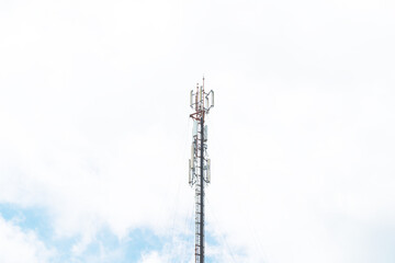 Telecommunication mast TV antennas in the afternoon ,on the hill blue sky with cloud bright at Phuket Thailand.