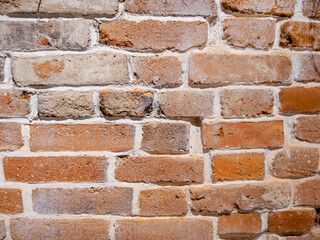 Background. Brick wall. Red brick with cement solution