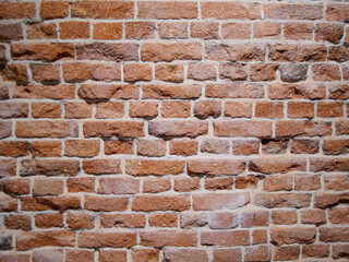 Background. Brick wall. Red brick with cement solution