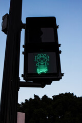 Detail of the pedestrian traffic light with the image of the emblematic Otomi doll, Lele, in downtown Queretaro, Mexico.