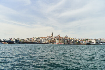 Obraz premium View of the Galata Tower across the Bosphorus Bay from the Fatih area. Istanbul, Turkey. High quality photo