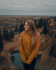 Girl on the background of nature, lake and forest