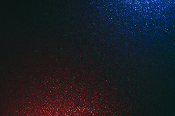Fototapeta na wymiar Glitter overlay. Blur neon light. Grain texture. Shimmering radiance. Hot cold flare. Defocused blue red color glow shiny sequin pattern on dark black abstract background.