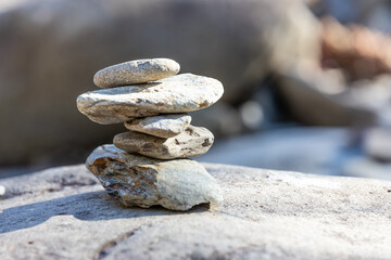 Fototapeta na wymiar Stack of stones found by the river