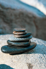 stack of stones by a mountain river