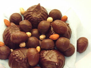 chocolate candies, marshmallows, marmalade and various nuts close-up. High quality photo
