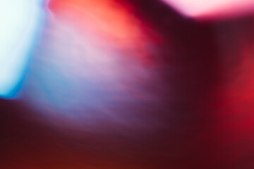 Color lens flare. Futuristic background. Blur fluorescent uv led illumination. Defocused neon red...