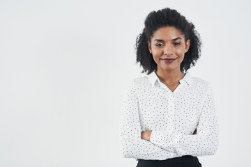 Know your worth. Studio shot of a confident young businesswoman against a gray background.