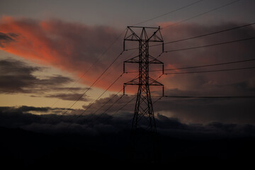 Power tower against a dramatic beautiful sunset sky