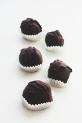 Tasty chocolate bonbon sweets on light backround