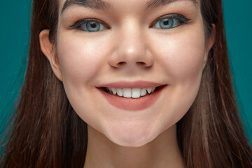 Obraz premium Close up young girl with healthy smile, white teeth, satisfied with dental whitening service. Natural beauty, hygiene