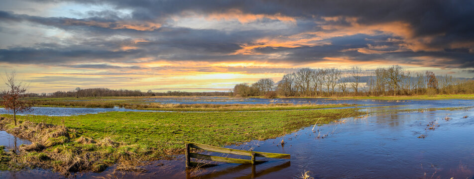Sunset landscape of the catchment area of the Gastersche Diep, part of the Drentse Aa. After extreme rainfall, the stream bursts its banks and the marsh overflows along the banks