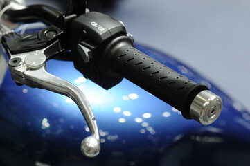 Motorcycle accelerator handle. Racers twist the throttle to increase their speed in the world motorcycle championship.