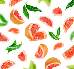 Background of grapefruit pieces and green leaves isolated on white background.