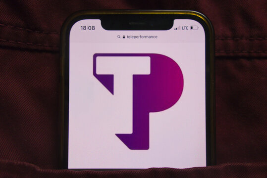 KONSKIE, POLAND - February 22, 2022: Teleperformance SE company logo on mobile phone hidden in jeans pocket