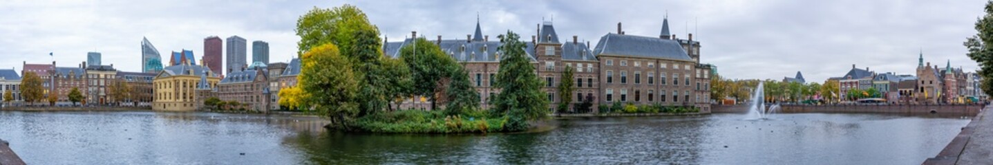 Fototapeta na wymiar 180 degree panoramic photo of the Hofvijver and the Binnenhof with possibly the oldest parliament complex in Europe that still serves as such and at the very back the skyline of The Hague