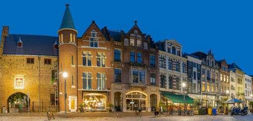 Fototapeta na wymiar Panoramic photo during the blue hour of the GevangenPoort and the old building aan de Plaats en Buitenhof in The Hague