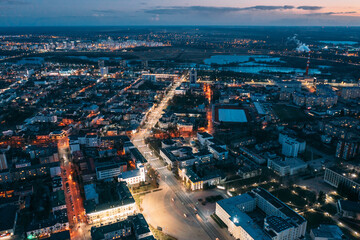 Brest, Belarus. Top View Of Cityscape Skyline City In Evening Illuminations. Night Aerial View Of...