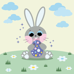 Easter bunny with egg. A postcard for the Easter holiday. A rabbit is sitting in a clearing.