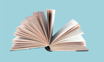 Turning paper book pages. Open literature photo.