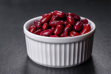 Canned red kidney beans in white bowl on a table