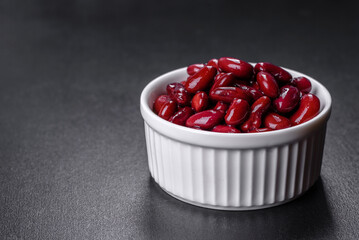 Canned red kidney beans in white bowl on a table