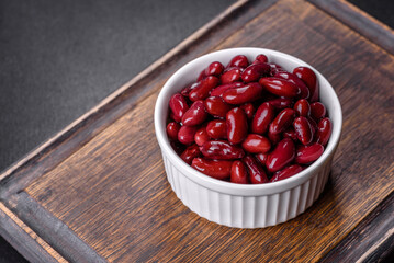 Canned red kidney beans in white bowl on a table