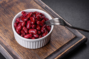 Canned red kidney beans in white bowl on a table