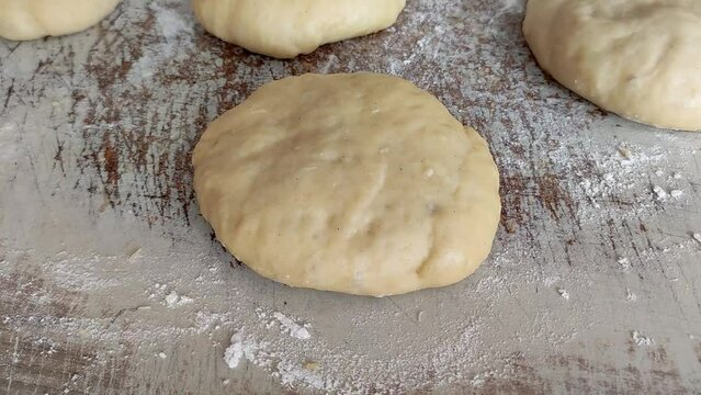 Timelapse of second increases of yeast dough for Polish traditional donuts (paczki).