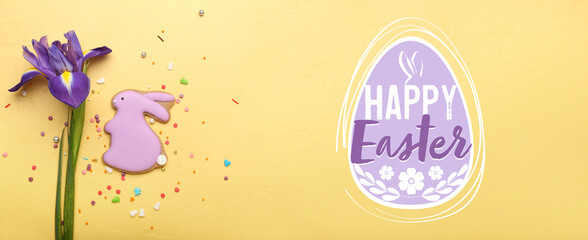 Naklejka premium Tasty Easter cookie in shape of bunny and iris flower on yellow background
